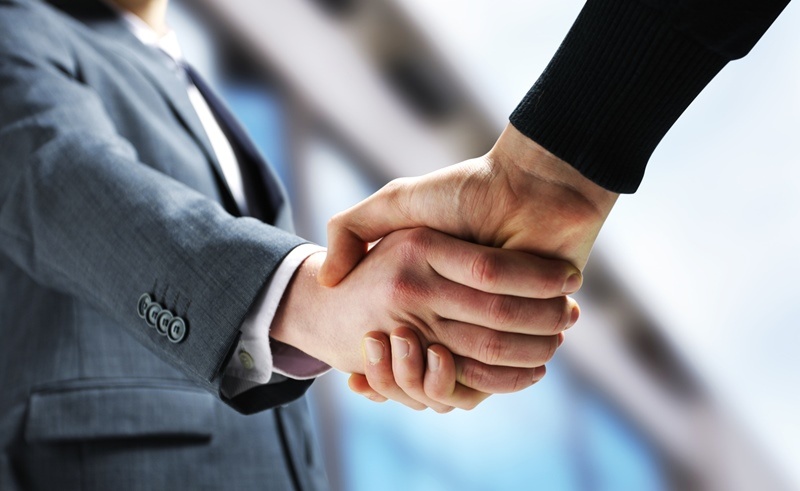 Two businessmen shaking hands.